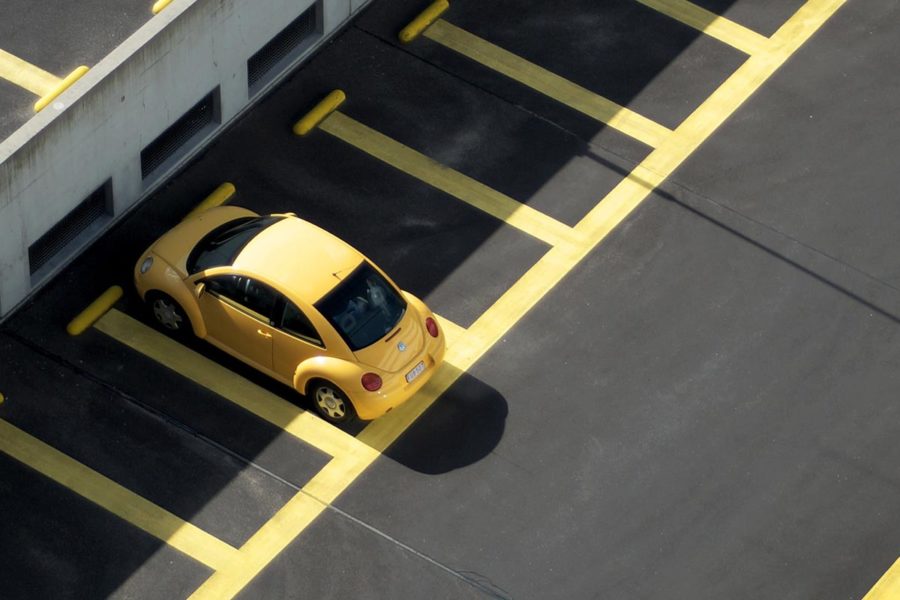 yellow car in car park